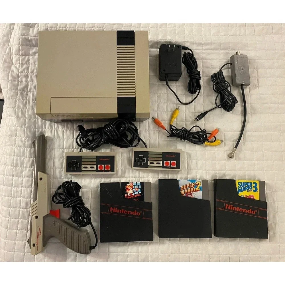 authentic NES Console Bundle with Super Mario Bros. 1,2,3 and 2 Controllers gun